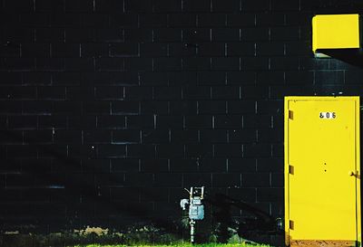 Yellow building at night