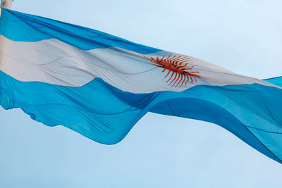 Low angle view of flag against sky