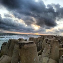 Scenic view of sea against cloudy sky