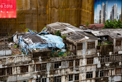 Abandoned clothes drying on roof of building