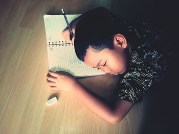 High angle view of young woman sitting at home