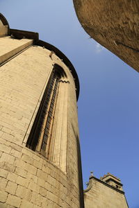 Low angle view of bell tower against sky