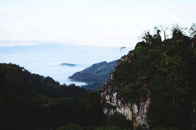 Scenic view of mountains against cloudy sky