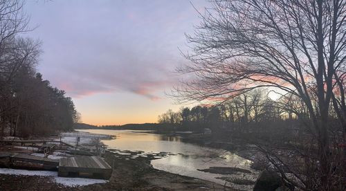 Scenic view of lake against sky during winter