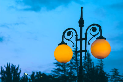 Low angle view of street light against sky