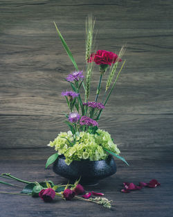 Close-up of pink flower vase on table