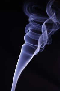 Close-up of light painting against black background