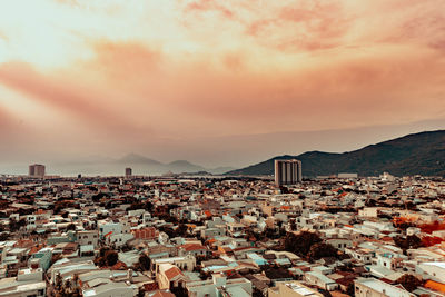 High angle view of townscape against sky during sunset