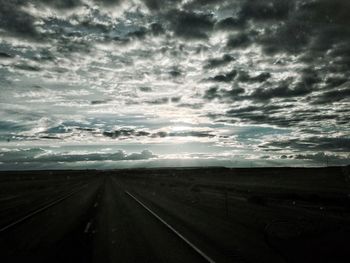 View of road against cloudy sky