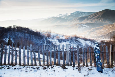 Scenic view of snow covered mountains against sky