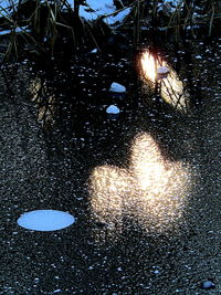 Close-up of illuminated christmas lights at beach