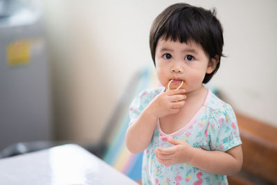 Portrait of cute girl at home