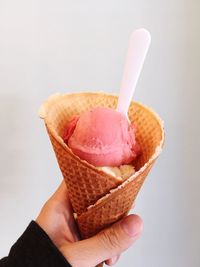 Close-up of hand holding ice cream