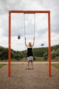 Full length of girl playing in playground