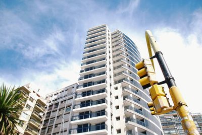 Low angle view of modern buildings against sky