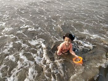 High angle view of child on beach