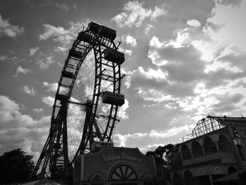 Low angle view of ferris wheel against sky