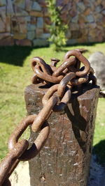 Close-up of rusty chain on field