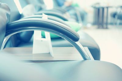 Close-up of empty chairs on table