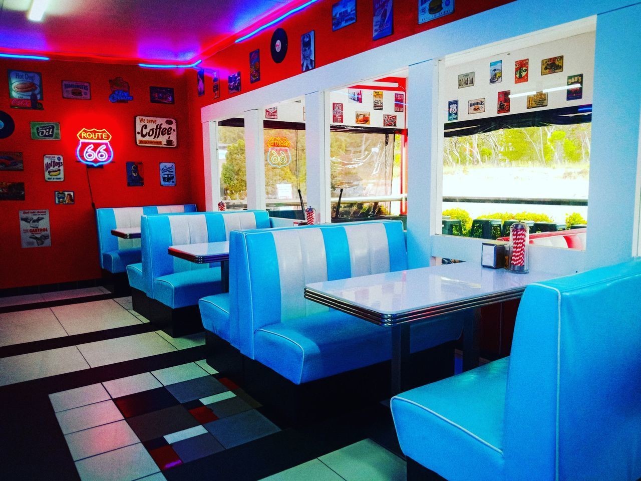 EMPTY CHAIRS AND TABLES AT RESTAURANT