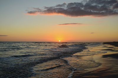 Scenic view of sea against sky during sunsets