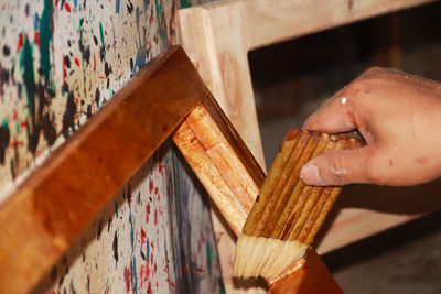 Close-up of hand holding painting