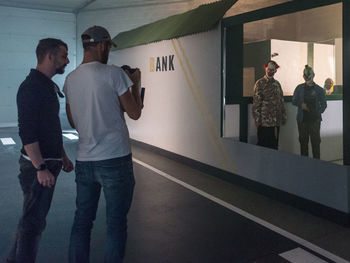 Group of people standing against wall