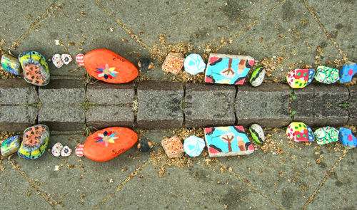 High angle view of multi colored stones on footpath