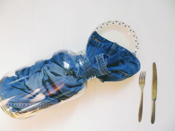 High angle view of shoes against white wall at home