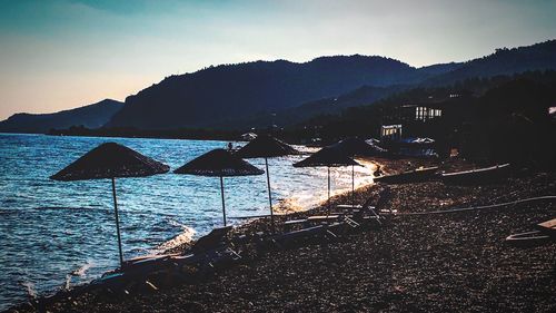 Scenic view of sea with mountains in background