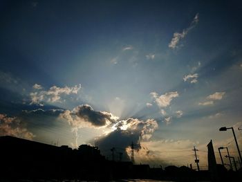 Low angle view of silhouette tree against sky