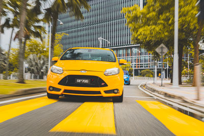 Yellow car on street