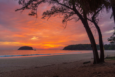 Scenic view of sea against romantic sky at sunset