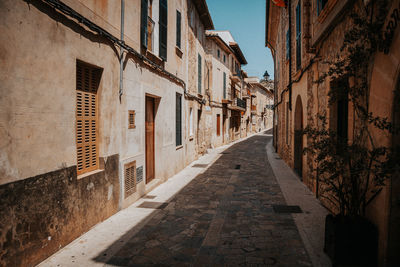 Narrow alley amidst old buildings in town