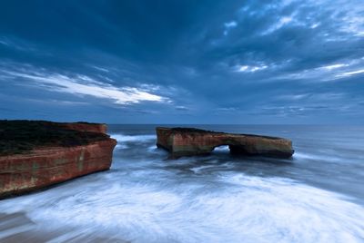 Scenic view of sea against cloudy sky