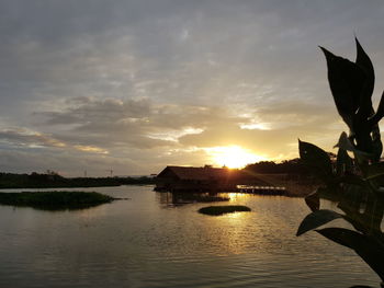 Scenic view of lake against sky during sunset