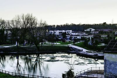 High angle view of river by city against sky