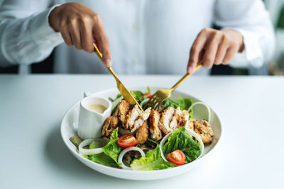 Cropped hand of person having food