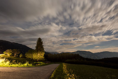 Empty road leading towards mountains