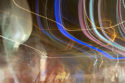 Full frame shot of illuminated light trails at night