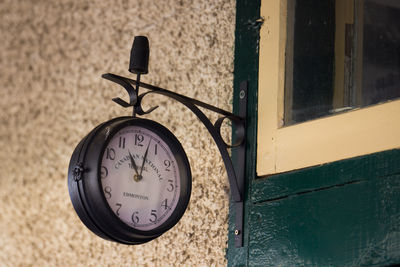 Close-up of clock on wall