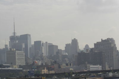 Modern buildings in city against sky