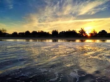 Scenic view of sunset over lake