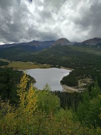 Scenic view of mountains against cloudy sky