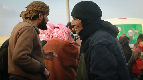 Side view of senior woman standing outdoors