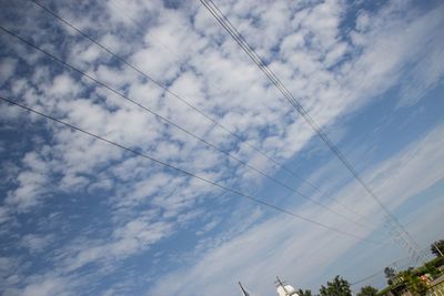 Low angle view of power lines against sky