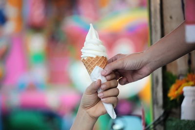 Hand holding ice cream cone