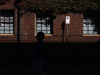 Man standing by railing