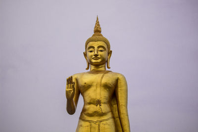 Statue of buddha against clear sky