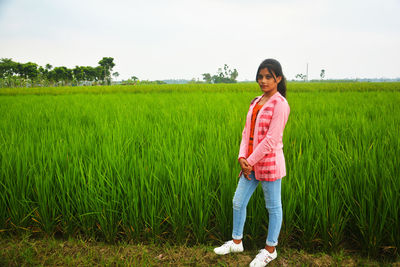 Full length of man standing on field
